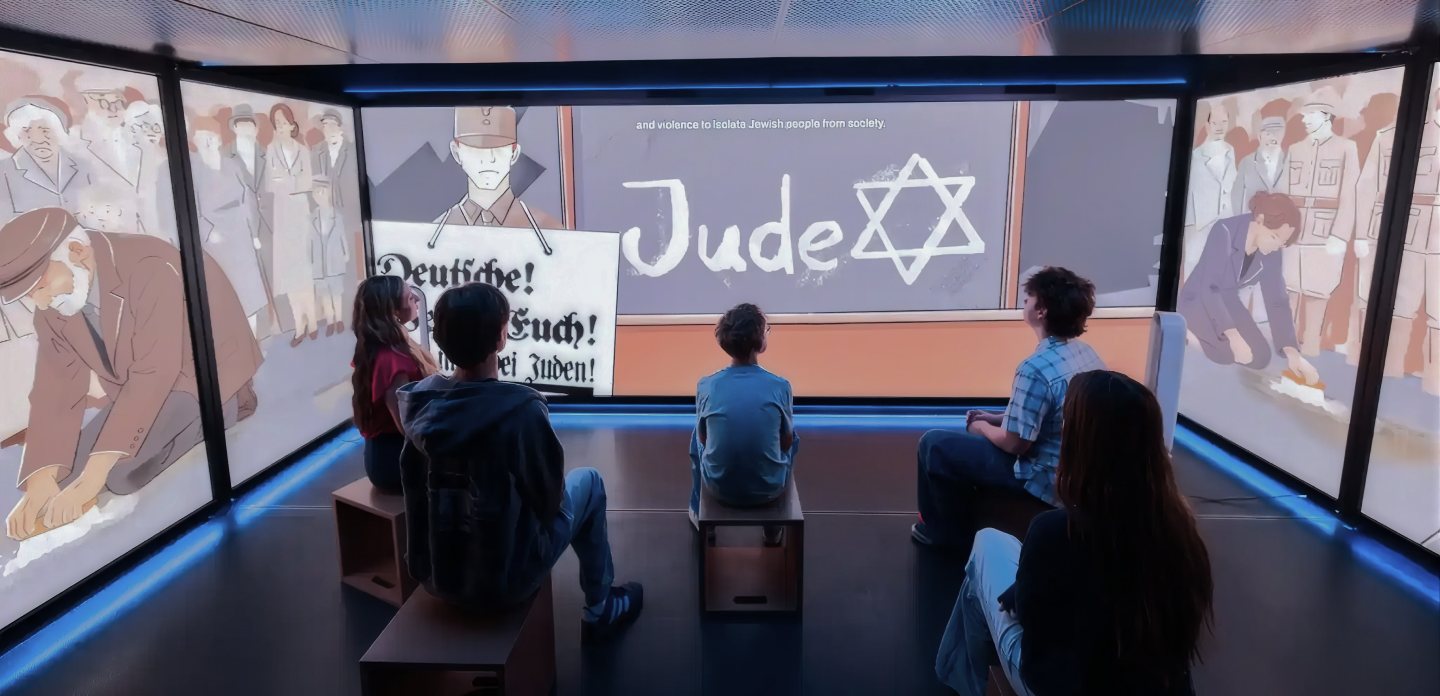 Visitors seated in the mobile museum watch the film wrap around three LED walls.